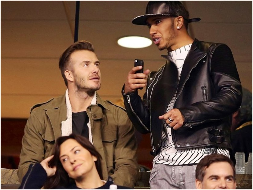 Com David Beckham no Super Bowl 2014 vestindo jaqueta de couro Givenchy, camiseta Christopher Kane e jeans Balmain