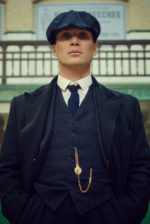 tommy-shelby-in-a-navy-pinstripe-suit-with-a-black-overcoat-900x540